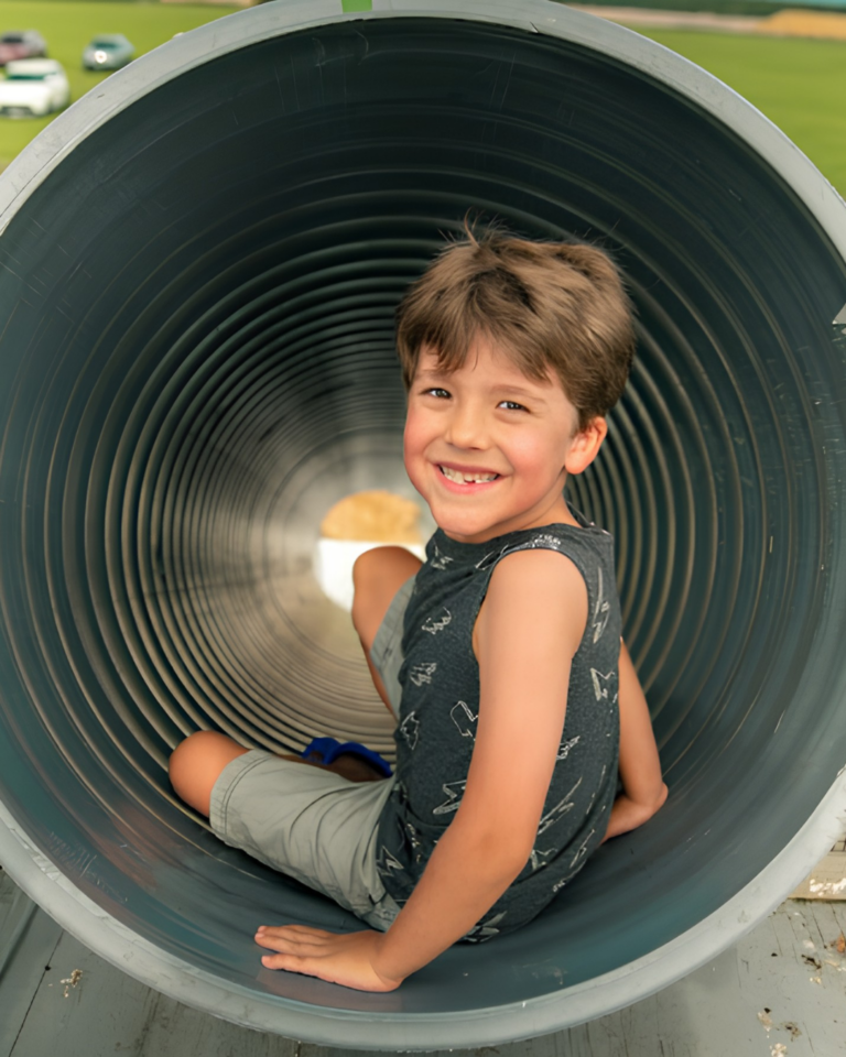 Young boy playing on Dade City Farms Slide Attraction