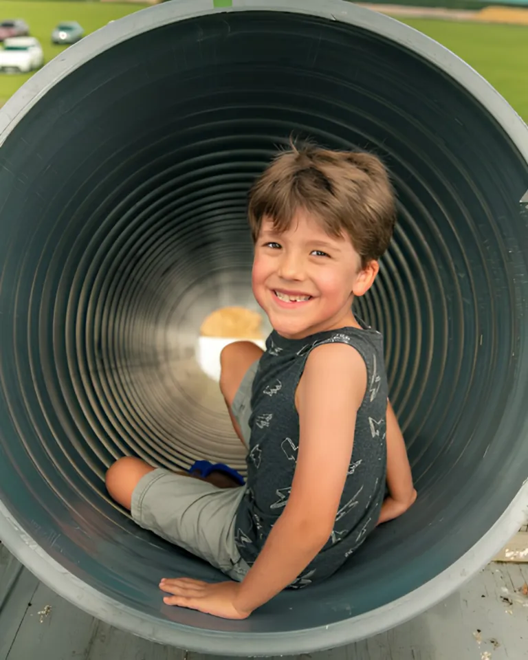 Young boy playing on Dade City Farms Slide Attraction